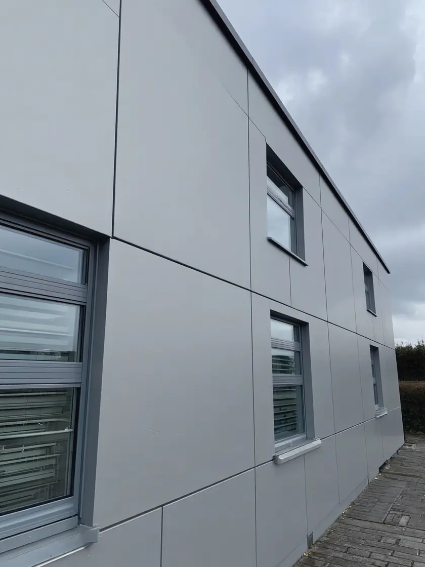A commercial building exterior freshly sprayed