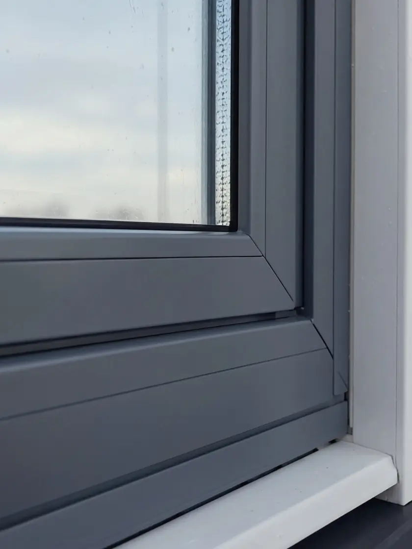 Close detail of a sprayed uPVC window frame corner